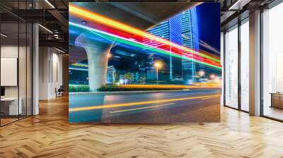 traffic with blur light through city at night. Wall mural