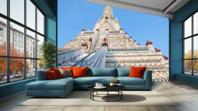 Wat Arun temple in a blue sky. Wat Arun is a Buddhist temple in Bangkok, Thailand. Wall mural