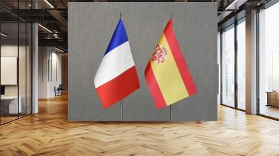 Table flags of France and Spain on a gray blurred background Wall mural