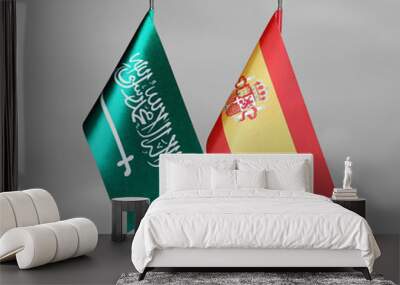 Table flags of Spain and Saudi Arabia on grey blurred background Wall mural