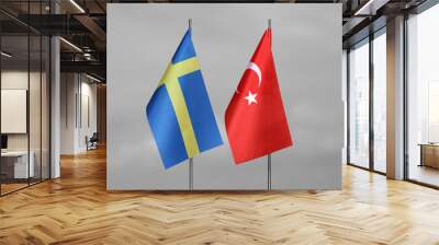 Table flags of Sweden and Turkey on a gray blurred background Wall mural