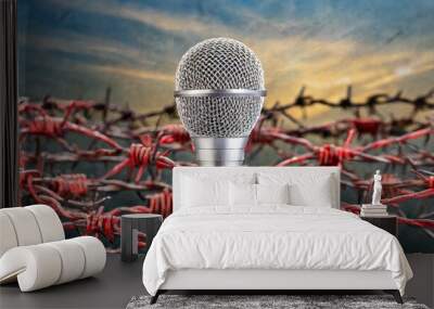 A microphone with red Barbed wire/ Freedom of the press is at risk concept - World press freedom day concept Wall mural