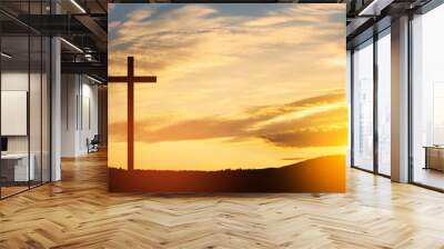 Christian cross on hill outdoors at sunrise. Resurrection of Jesus. Concept photo. Wall mural