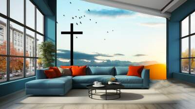 Christian cross on hill outdoors at sunrise. Resurrection of Jesus. Concept photo. Wall mural