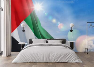 Flag of United Arab Emirates on background of blue sky. UAE celebration. National day, Flag day, Commemoration day, Martyrs day. Wall mural