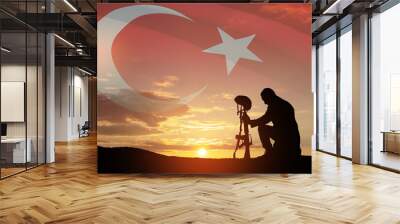 Silhouette of soldier kneeling with his head bowed against the sunrise or sunset and Turkey flag. Concept of crisis of war and conflicts. Greeting card for Turkish Armed Forces Day, Victory Day. Wall mural