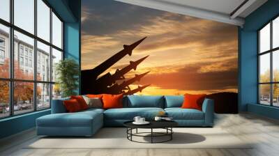 The missiles are aimed to the sky at sunset. Nuclear bomb, chemical weapons, missile defense, a system of salvo fire. Wall mural