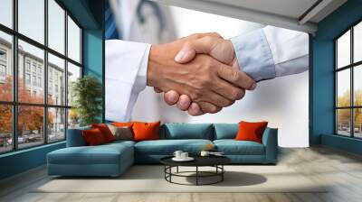 a close-up of two people shaking hands, one wearing business clothes and the other a medical coat, signifying confidence between a businessman and a doctor during a crucial meeting.  Wall mural