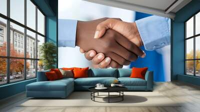 a close-up of two people shaking hands, one wearing business clothes and the other a medical coat, signifying confidence between a businessman and a doctor during a crucial meeting.  Wall mural