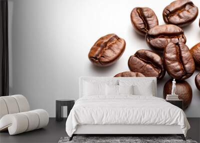 Isolated on a white background are roasted arabica coffee beans. Wall mural