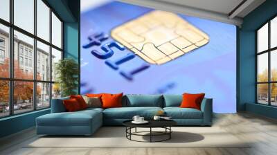 Chip of the blue credit card, closeup shot. Closeup of old credit card. Close up of chip for secure payment. Wall mural