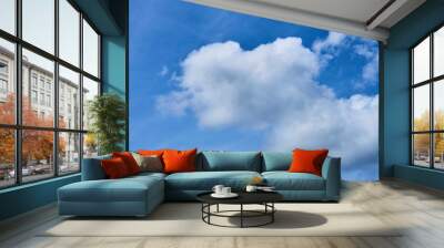 Clouds on a blue sky sunny day Wall mural