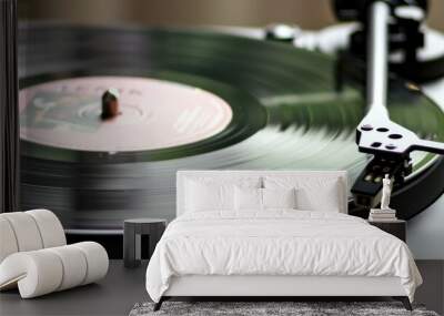 A close-up of a spinning vinyl record on a turntable, capturing the motion and detail. Wall mural