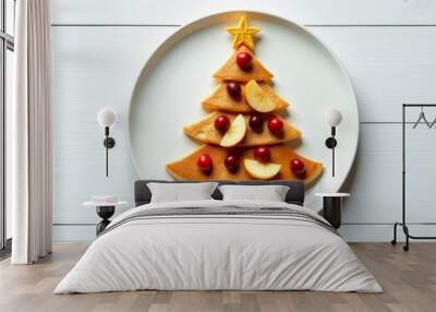 A Christmas tree of pancakes lies on a white plate. Wall mural