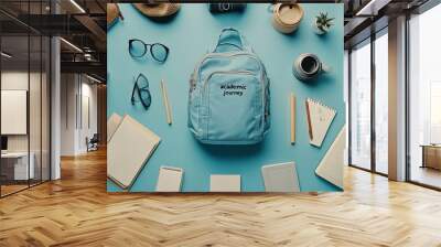 A blue backpack with the words Academic Journey embroidered on it is surrounded by various school supplies, including notebooks, pencils, glasses, a hat, and potted plants on a blue background. Wall mural