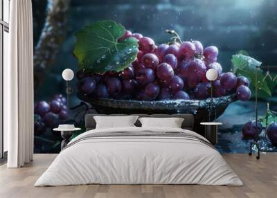 Close-up of a bowl of red grapes with water droplets on the fruit and leaves. Wall mural