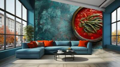 Green beans in tomato sauce, top view, on a dark background. Wall mural