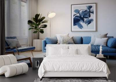 Modern living room with a blue sofa, coffee table, and two chairs. Wall mural