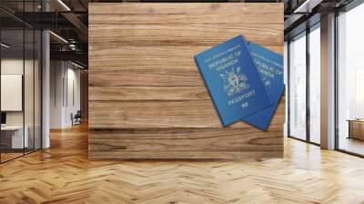 two Uganda passport on a wooden board  Wall mural