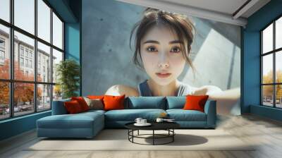 Determined asian woman in fitness attire Wall mural