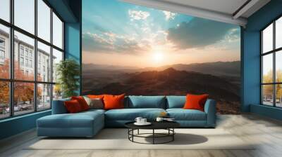 A beautiful sunset over a mountain range Wall mural