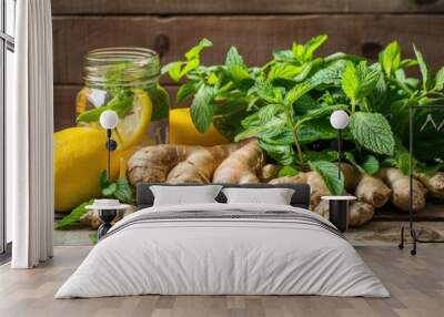 Lemonade with ginger, lemon and mint on a wooden background Wall mural