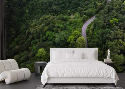 Aerial view of road in the middle of the forest , Top view road curve construction up to mountain, Rainforest ecosystem and healthy environment concept	
 Wall mural