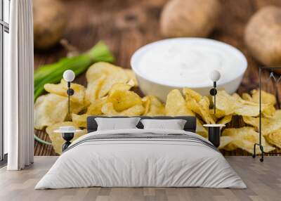 Portion of Potato Chips with Sour Cream taste on wooden backgrou Wall mural