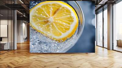 Close-up of a Lemon Slice in a Glass of Sparkling Water Wall mural