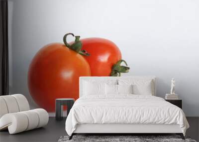 Portrait of two fresh tomatoes on a white background Wall mural