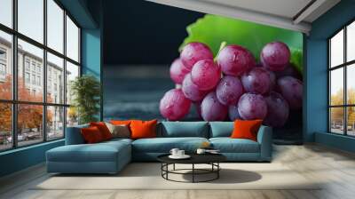  bunch of grapes on dark wooden table with dark background Wall mural