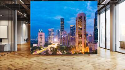 Aerial view of Jakarta's Central Business District at dusk (blue hour). Jakarta cityscape at sunset. A panorama stitched from 3 photos. Jakarta cityscape. Widescreen photo. Wall mural