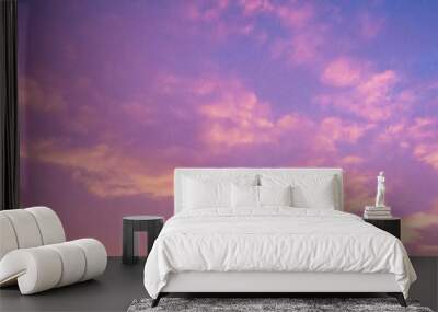 Beautiful cloudy sunset sky with orange, purple, pink, and magenta hue; with vibrant colors. Abstract nature background. Wall mural