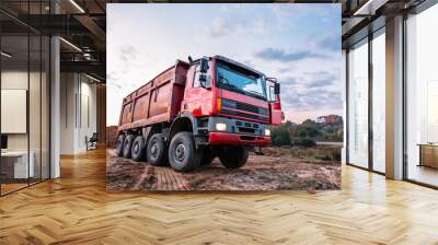 A dump truck is dumping gravel on an excavation site. May be cut to banner or wallpaper with copy space. Wall mural