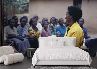 Community Meeting in Rural Village with Smiling Female Leader Engaging Participants Wall mural