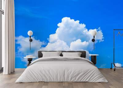 One isolated white cloud in a blue sky. Heaven background. Wallpaper. Beautiful cloudscape. Cumulus clouds. Weather forecast. Outdoor natural landscape. Banner. Dreams. Summer season Wall mural