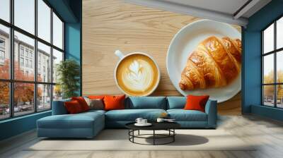 Plate of croissant and cup of cappuccino on a wooden table, top view. Wall mural