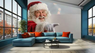 Smiling Santa Claus pointing on blank Wall mural