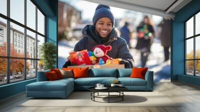 Smiling Volunteer Donating Toys on a Sunny Winter Day During Community Charity Event Wall mural