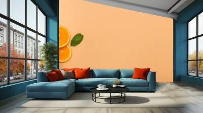 summer background concept: sliced orange, grapefruit, lemon, lime, mint on orange background Wall mural