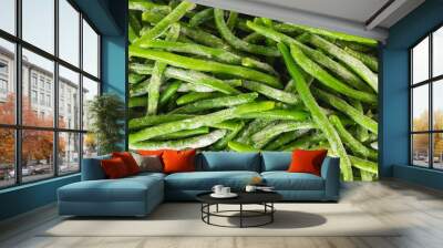 Frozen green beans, haricots verts, close up from above. Fresh raw vegetable food background Wall mural