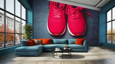 red sneakers on a black background Wall mural