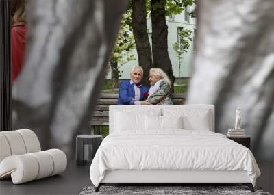 People sitting , fashionable clothes, park bench in a modern cit Wall mural