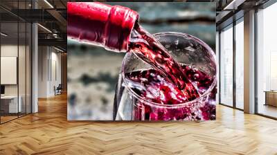 Pouring wine, pouring red wine. Wine in a glass, selective focus, motion blur, Red wine in a glass. Wall mural