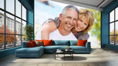 close-up portrait of a mature couple smiling and embracing. Wall mural