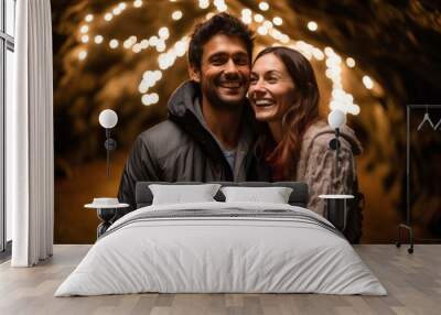 Couple in their 30s smiling at the Waitomo Glowworm Caves in Waikato New Zealand Wall mural