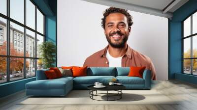 Portrait of a Brazilian man in his 30s in a white background wearing a chic cardigan Wall mural