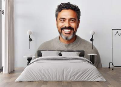 Portrait of a Saudi Arabian man in his 40s in a white background wearing a cozy sweater Wall mural