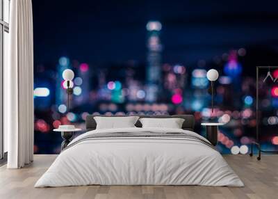 Bokeh lights of city skyline at night, modern city blur Wall mural