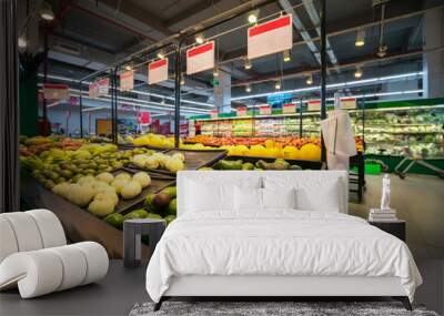 Fresh fruits on shelf in supermarket. Wall mural